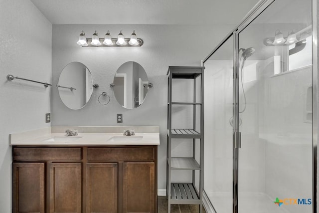 2588 Diamondback Trl, New Braunfels, TX 78130 - full bathroom featuring a stall shower and double vanity