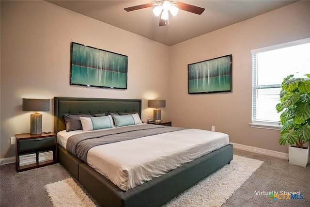 bedroom with ceiling fan and carpet floors