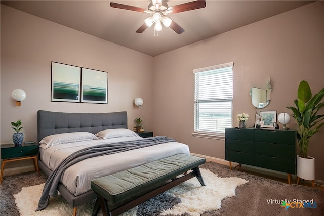 carpeted bedroom with ceiling fan