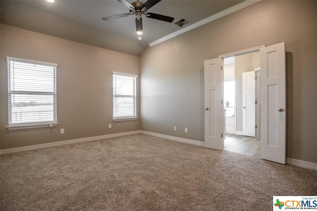 1027 Winchester Dr, Nolanville, TX 76559 - carpeted spare room featuring ceiling fan, crown molding, vaulted ceiling, and baseboards