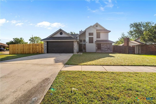 view of front of house featuring fence, a front lawn, driveway, and a garage