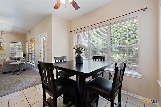2109 Grizzly Trl, Harker Heights, TX 76548 - dining area with light tile patterned floors, light colored carpet, and plenty of natural light
