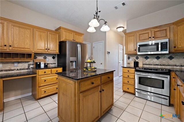 2109 Grizzly Trl, Harker Heights, TX 76548 - kitchen featuring appliances with stainless steel finishes, light tile patterned flooring, decorative backsplash, pendant lighting, and a center island