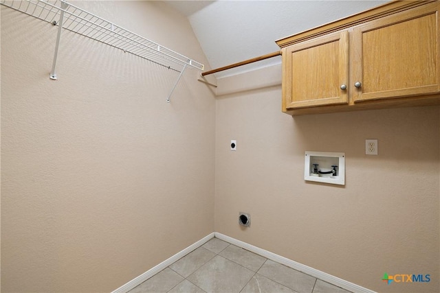 2109 Grizzly Trl, Harker Heights, TX 76548 - laundry room with hookup for an electric dryer, cabinet space, washer hookup, baseboards, and light tile patterned floors