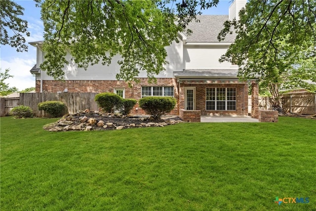 2109 Grizzly Trl, Harker Heights, TX 76548 - back of house with a patio area, brick siding, and a chimney