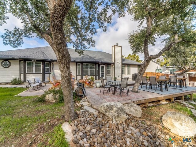 back of house with a patio area