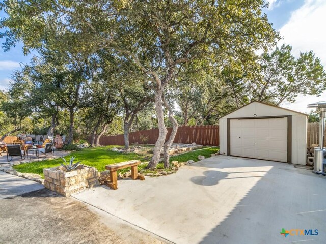 garage featuring a lawn