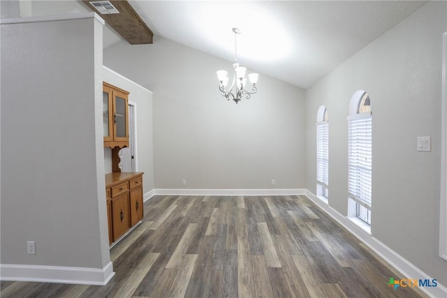 unfurnished dining area with vaulted ceiling with beams, dark hardwood / wood-style floors, and a notable chandelier