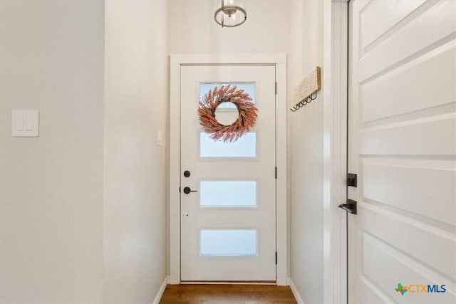 8620 Sunset Trl, Temple, TX 76502 - doorway to outside featuring wood finished floors and baseboards