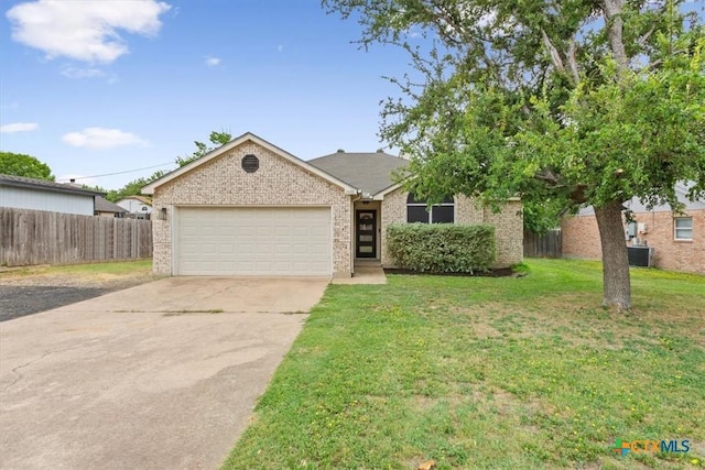 8620 Sunset Trl, Temple, TX 76502 - view of front of home with a garage, concrete driveway, and brick siding