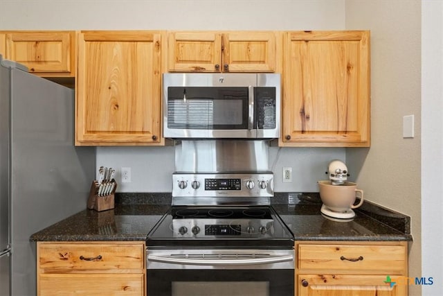 8620 Sunset Trl, Temple, TX 76502 - kitchen with stainless steel appliances, light brown cabinets, and dark stone countertops