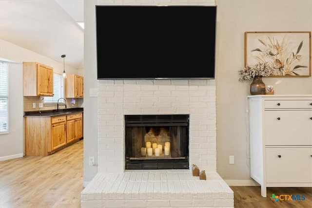 8620 Sunset Trl, Temple, TX 76502 - detailed view of wood finished floors and a brick fireplace