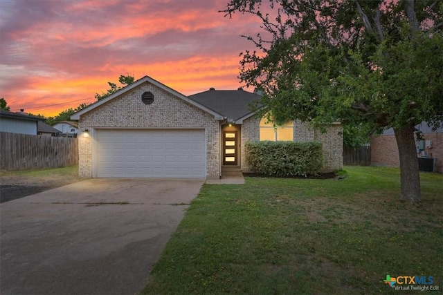 8620 Sunset Trl, Temple, TX 76502 - view of front of house featuring concrete driveway, an attached garage, and brick siding