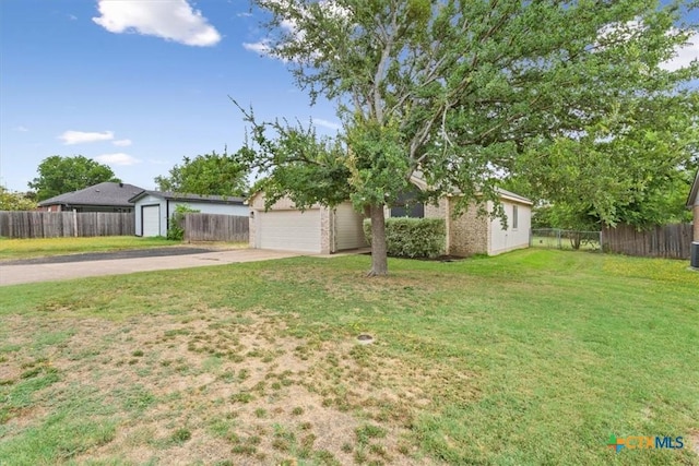 8620 Sunset Trl, Temple, TX 76502 - view of front of home with driveway, a garage, and an outbuilding