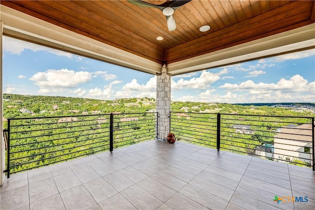 view of patio / terrace featuring ceiling fan and a balcony