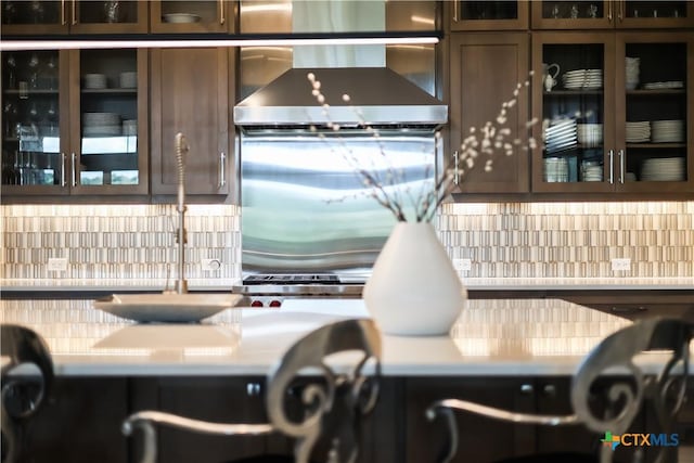 kitchen with wall chimney exhaust hood