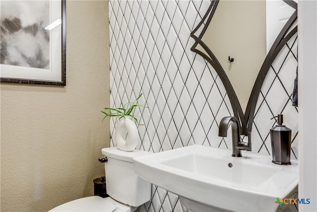 bathroom with toilet and sink