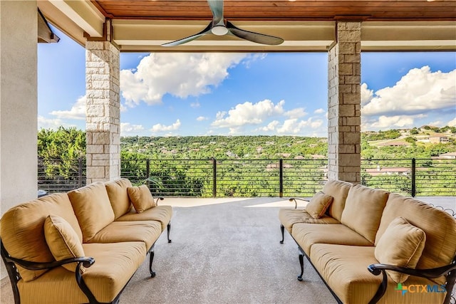 view of patio featuring ceiling fan, an outdoor living space, and a balcony