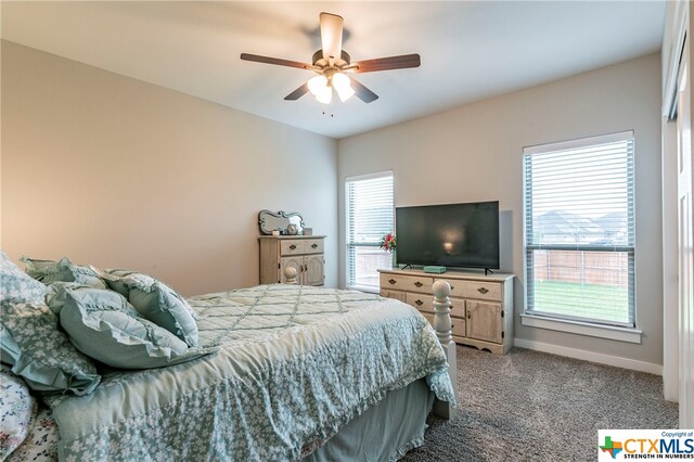 carpeted bedroom with ceiling fan