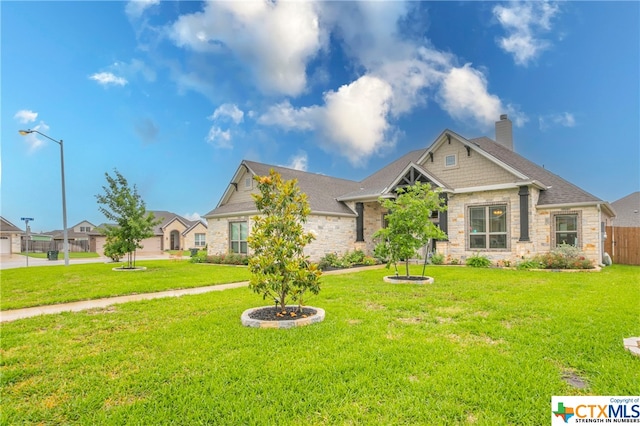 craftsman inspired home with a front yard