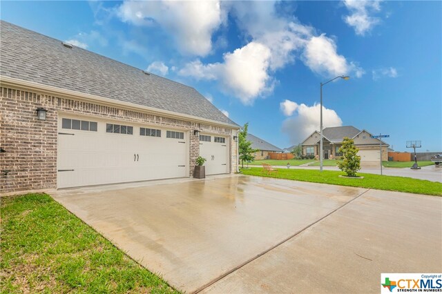 garage featuring a yard