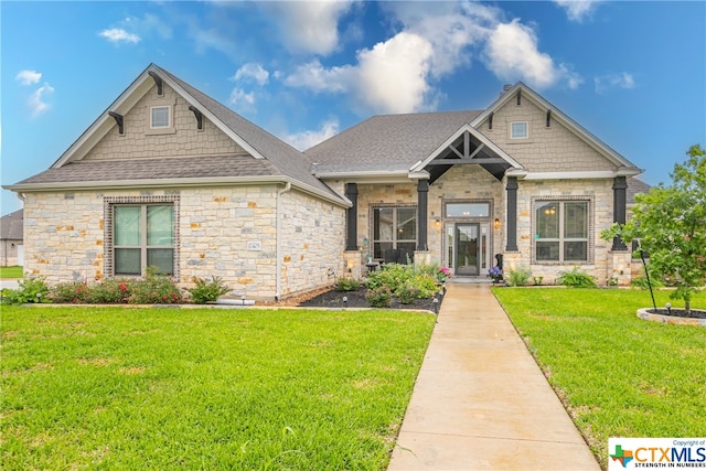 craftsman-style house with a front yard