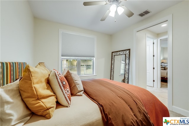 carpeted bedroom with ceiling fan