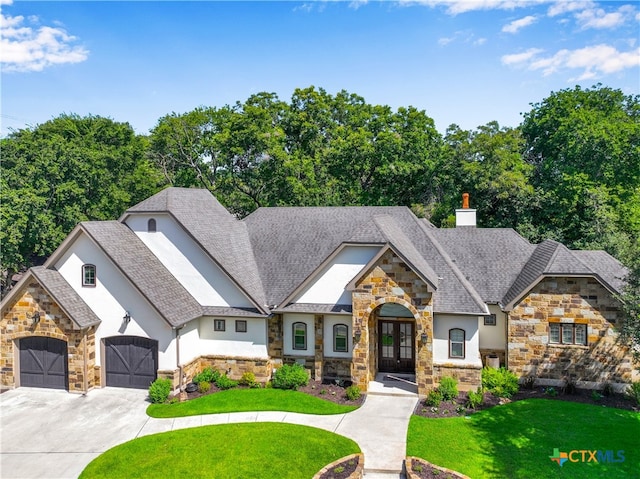 view of front of house with a front lawn and french doors