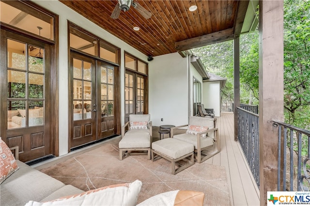 deck with french doors and ceiling fan