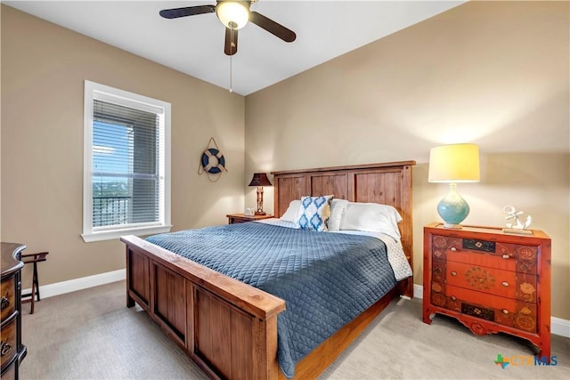 bedroom featuring ceiling fan and light colored carpet