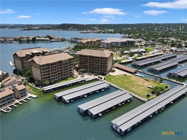 birds eye view of property featuring a water view