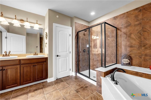 bathroom featuring tile patterned floors, separate shower and tub, and vanity