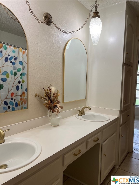 bathroom featuring tile patterned floors and vanity