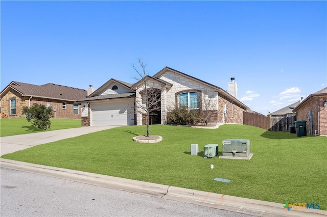 french country style house with a front yard, stone siding, driveway, and a chimney