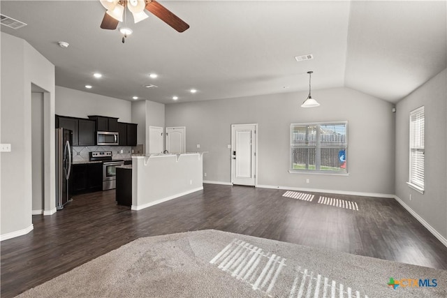 unfurnished living room featuring dark wood-style floors, visible vents, vaulted ceiling, and ceiling fan