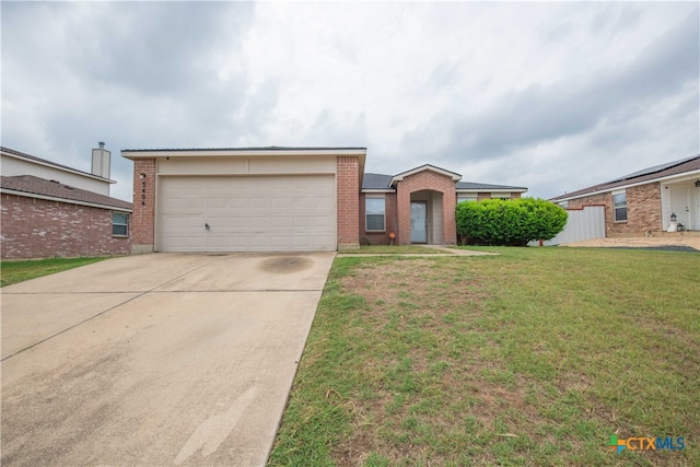 ranch-style house with a front lawn and a garage