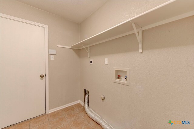 washroom with tile patterned floors, gas dryer hookup, hookup for a washing machine, and hookup for an electric dryer