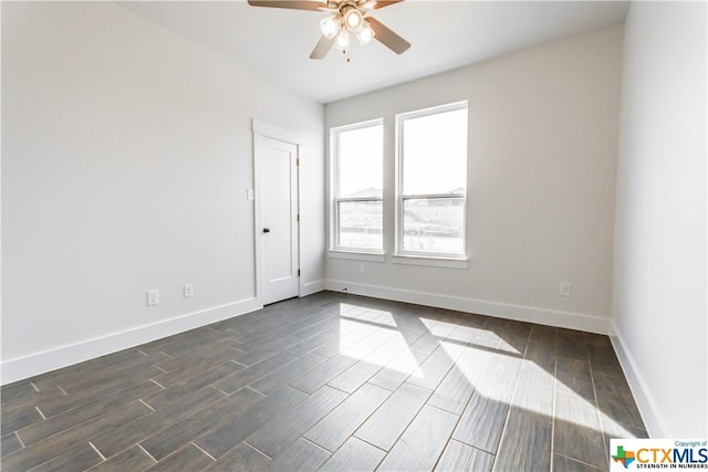 8500 Kasen Ave, Killeen, TX 76542 - spare room featuring a ceiling fan, dark wood-type flooring, and baseboards
