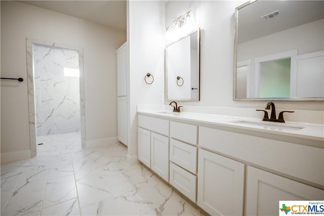 8500 Kasen Ave, Killeen, TX 76542 - bathroom featuring a marble finish shower, double vanity, marble finish flooring, and baseboards