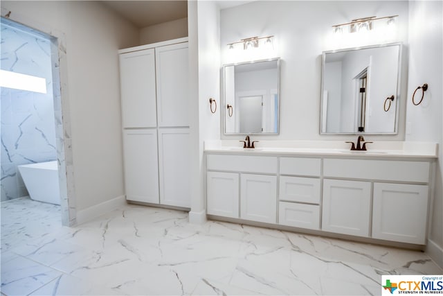 bathroom with a tub to relax in, vanity, and tile walls