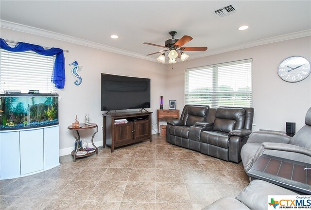 living room with ceiling fan and crown molding