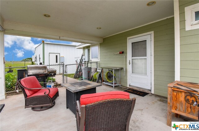 view of patio featuring a grill