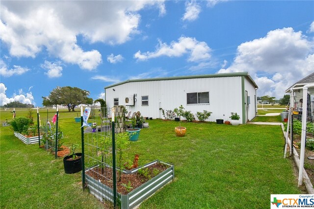 rear view of house with a lawn