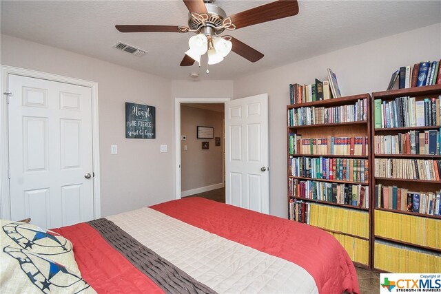 bedroom featuring a textured ceiling and ceiling fan