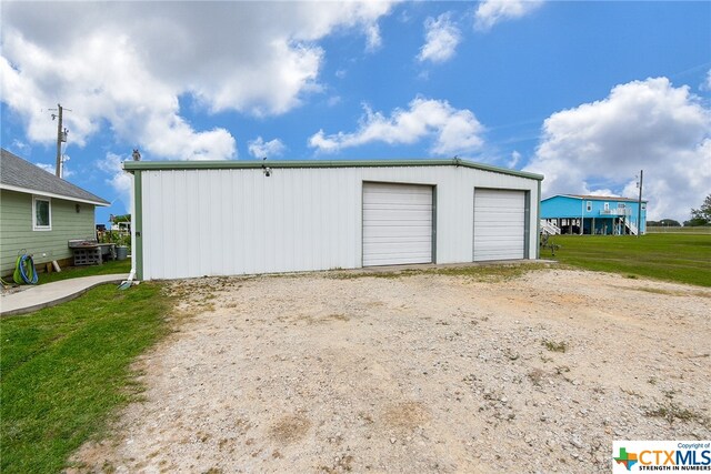 garage with a lawn