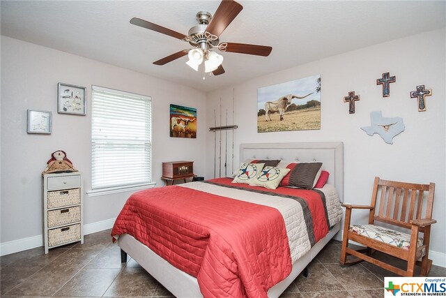 tiled bedroom with ceiling fan