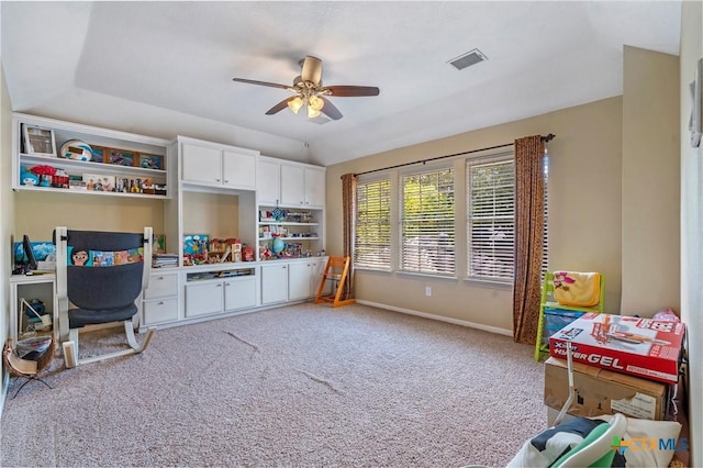 playroom featuring ceiling fan, light colored carpet, and vaulted ceiling