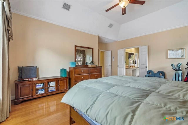 bedroom with ornamental molding, light hardwood / wood-style floors, ceiling fan, and lofted ceiling