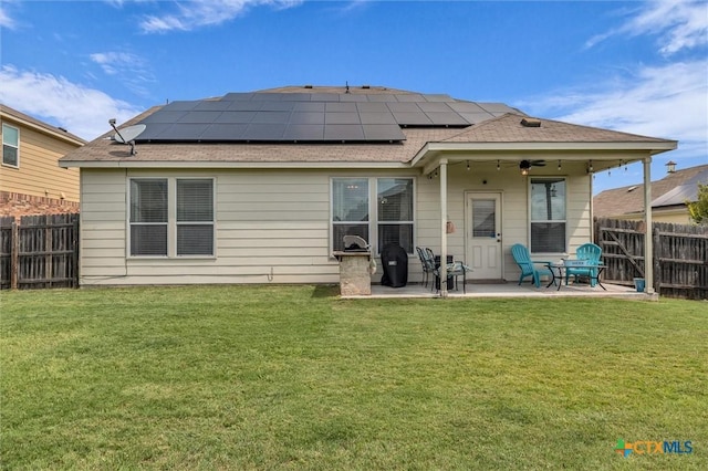 3312 Shawlands Rd, Killeen, TX 76542 - back of house with a patio, a fenced backyard, roof mounted solar panels, and a shingled roof