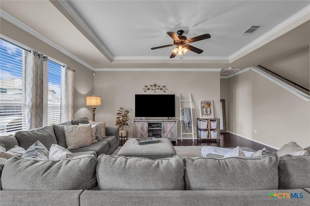 3312 Shawlands Rd, Killeen, TX 76542 - living area with a tray ceiling, a ceiling fan, dark wood-type flooring, and ornamental molding